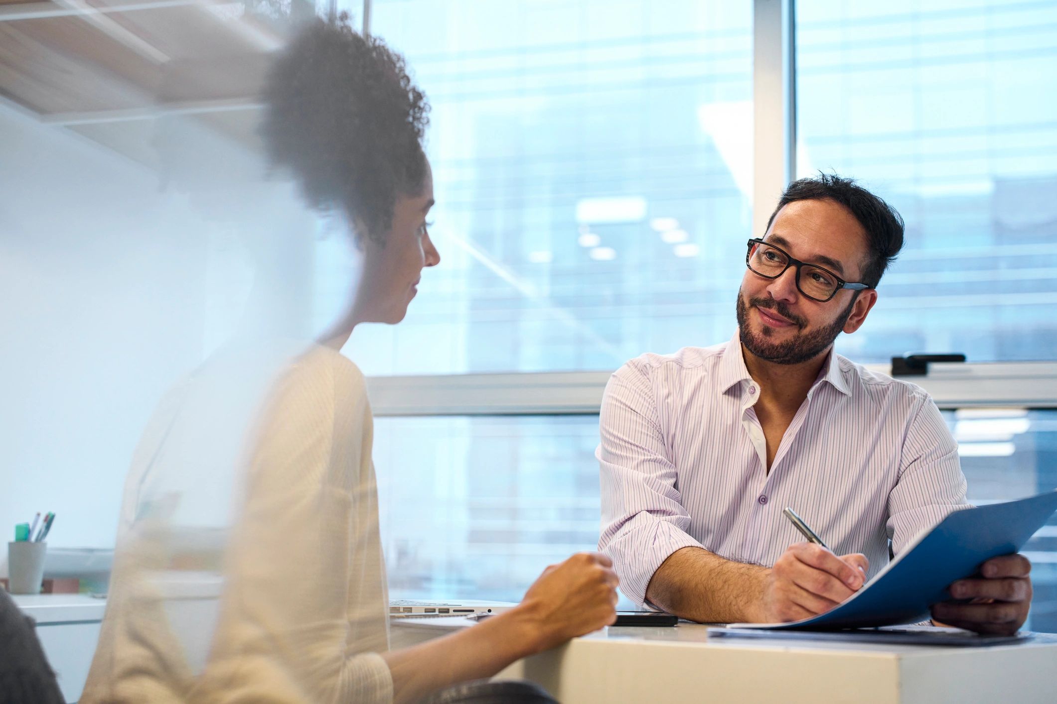 Professional headshot-style image of a business person in an office