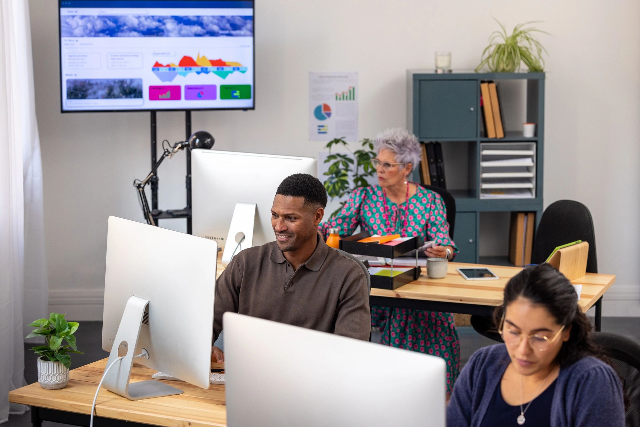 Team reviewing charts and data in a modern office