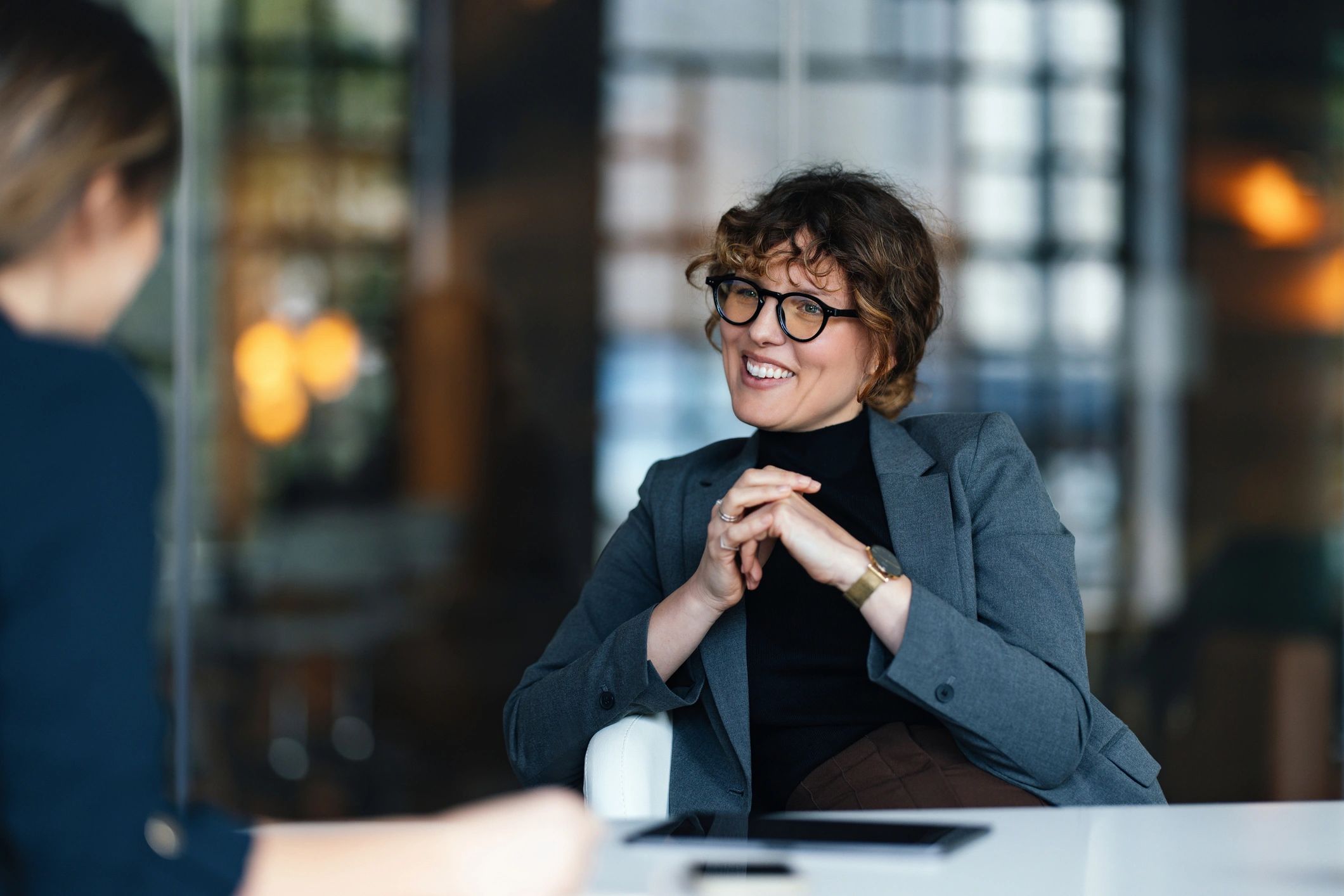Recruiter speaking with a candidate in a modern office